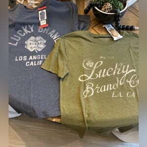 2 Men’s Lucky Brand shirts 1 size small and 1 size medium NWT